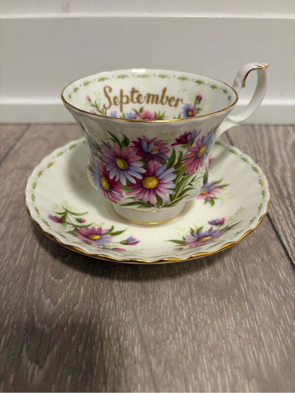 Royal Albert White Teacup and Saucer with Pink and Purple Floral Design